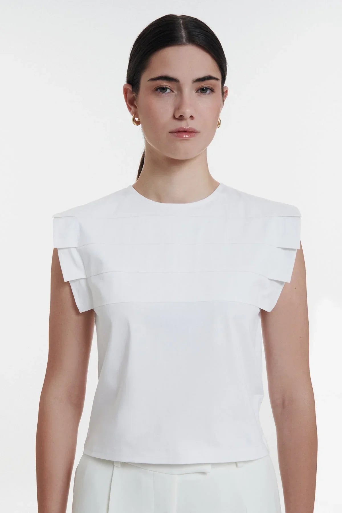 Chiara. White Sleeveless Pleated Top - UPTOANI